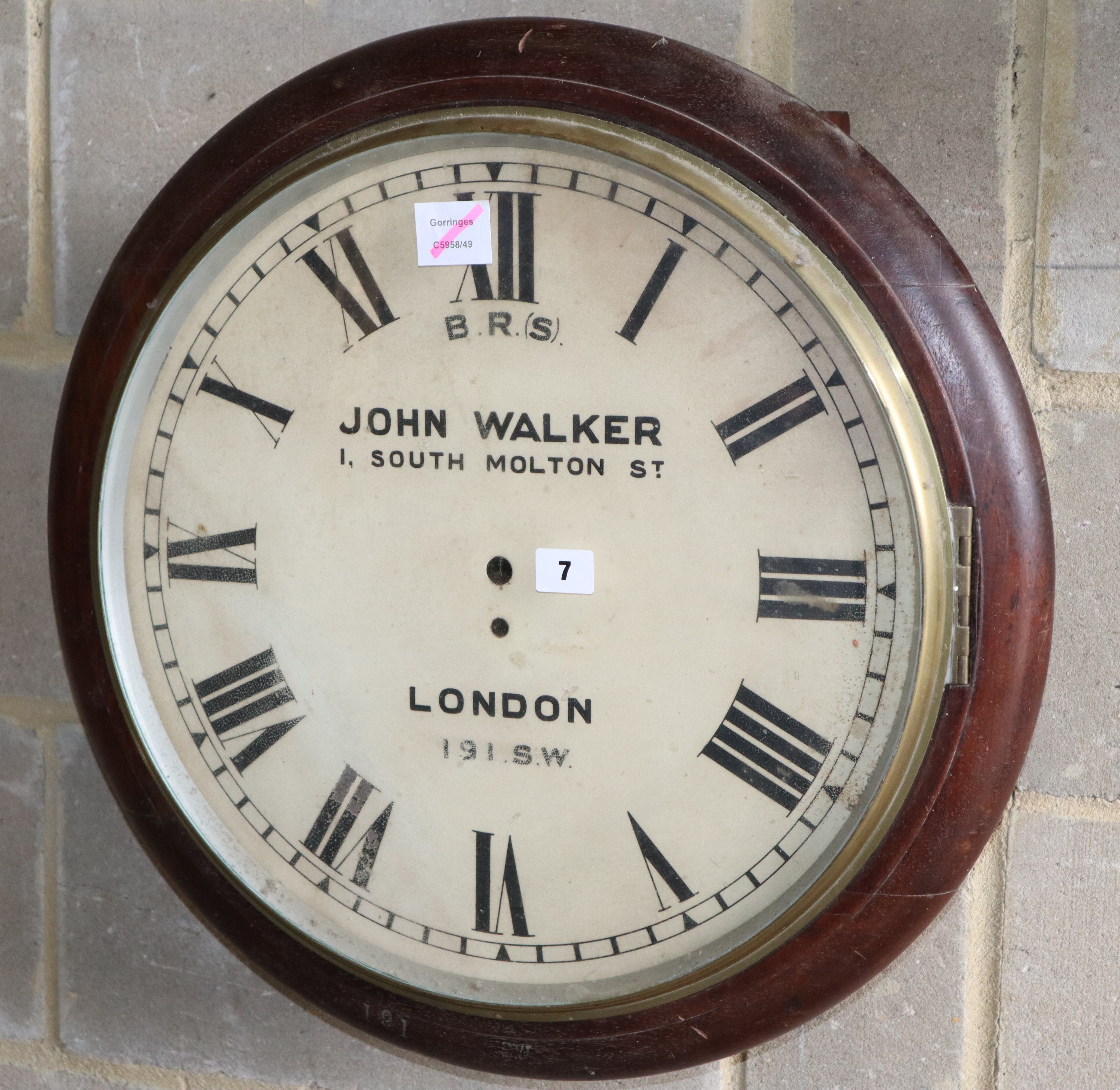 A large British Rail mahogany wall clock case, lacking movement, stamped 191SW, Diameter 57cm.